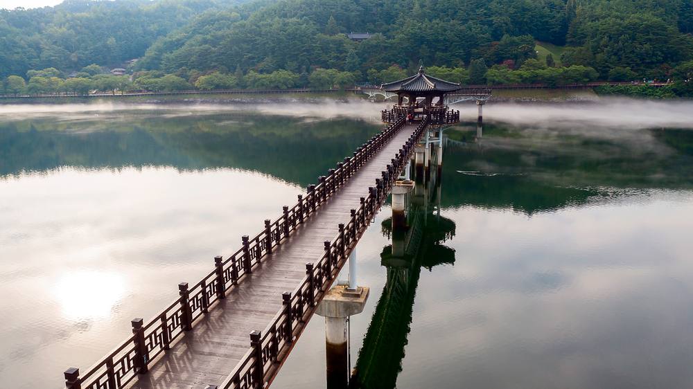 Woryeonggyo wooden footbridge over the river in Andong at dawn