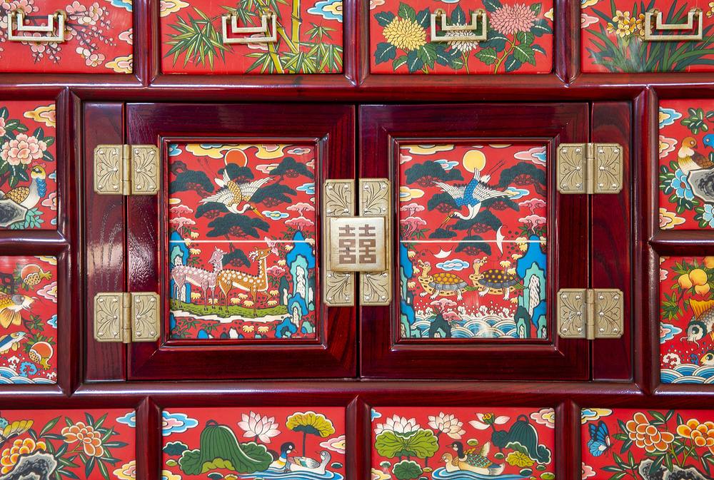 A colorful mother-of-pearl lacquered Korean chest with crane and deer motifs
