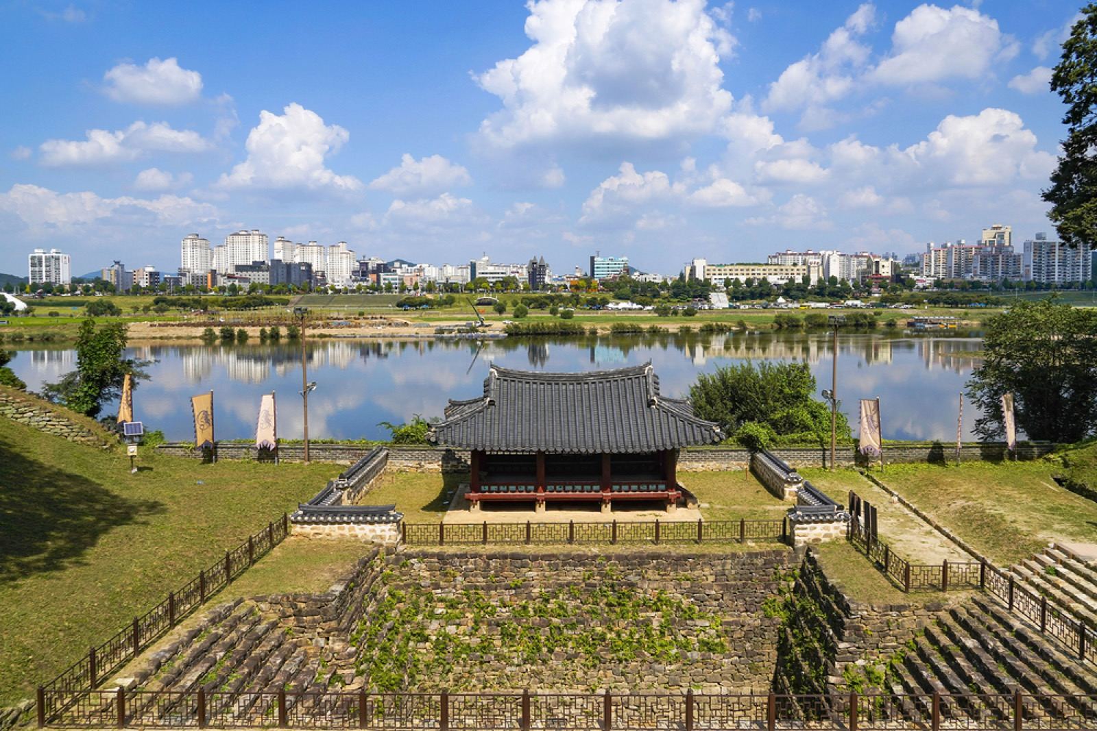 A traditional pavilion inside Gongsanseong fortress overlooking the Geumgang river in Gongju on a clear day