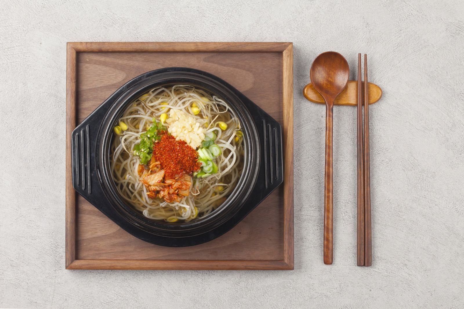 A hot stone bowl of kongnamul gukbap, bean-sprout and rice soup