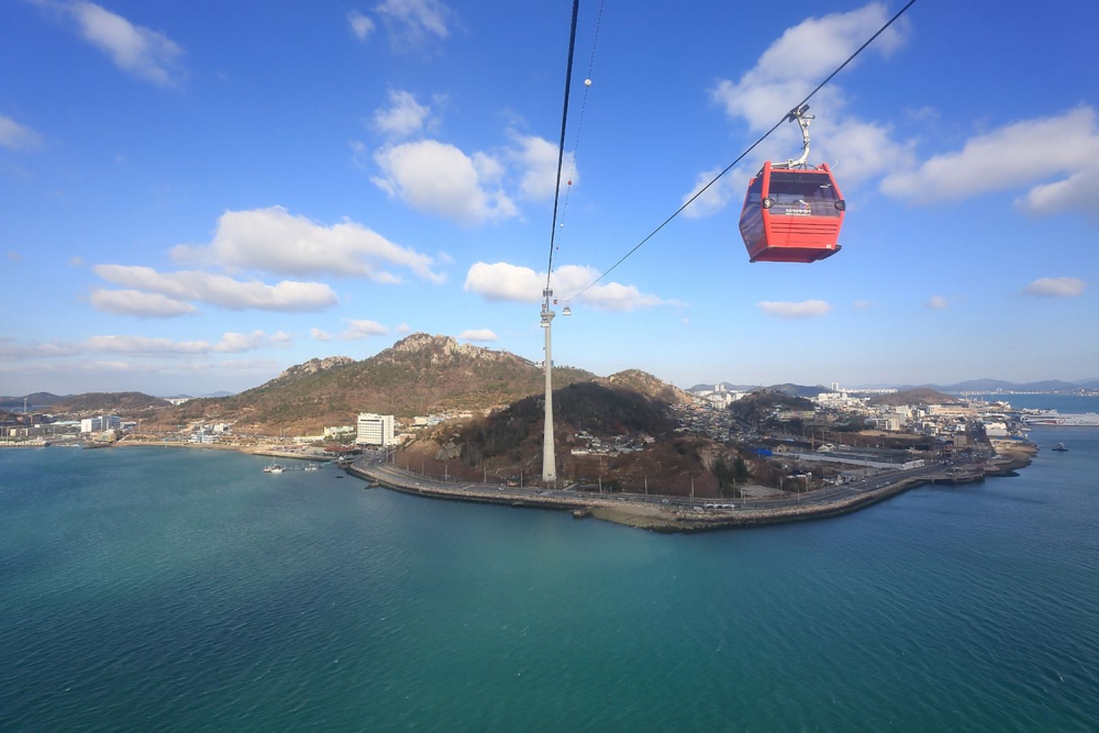 Mokpo's marine cable car crossing over the sea toward Yudalsan mountain at dusk