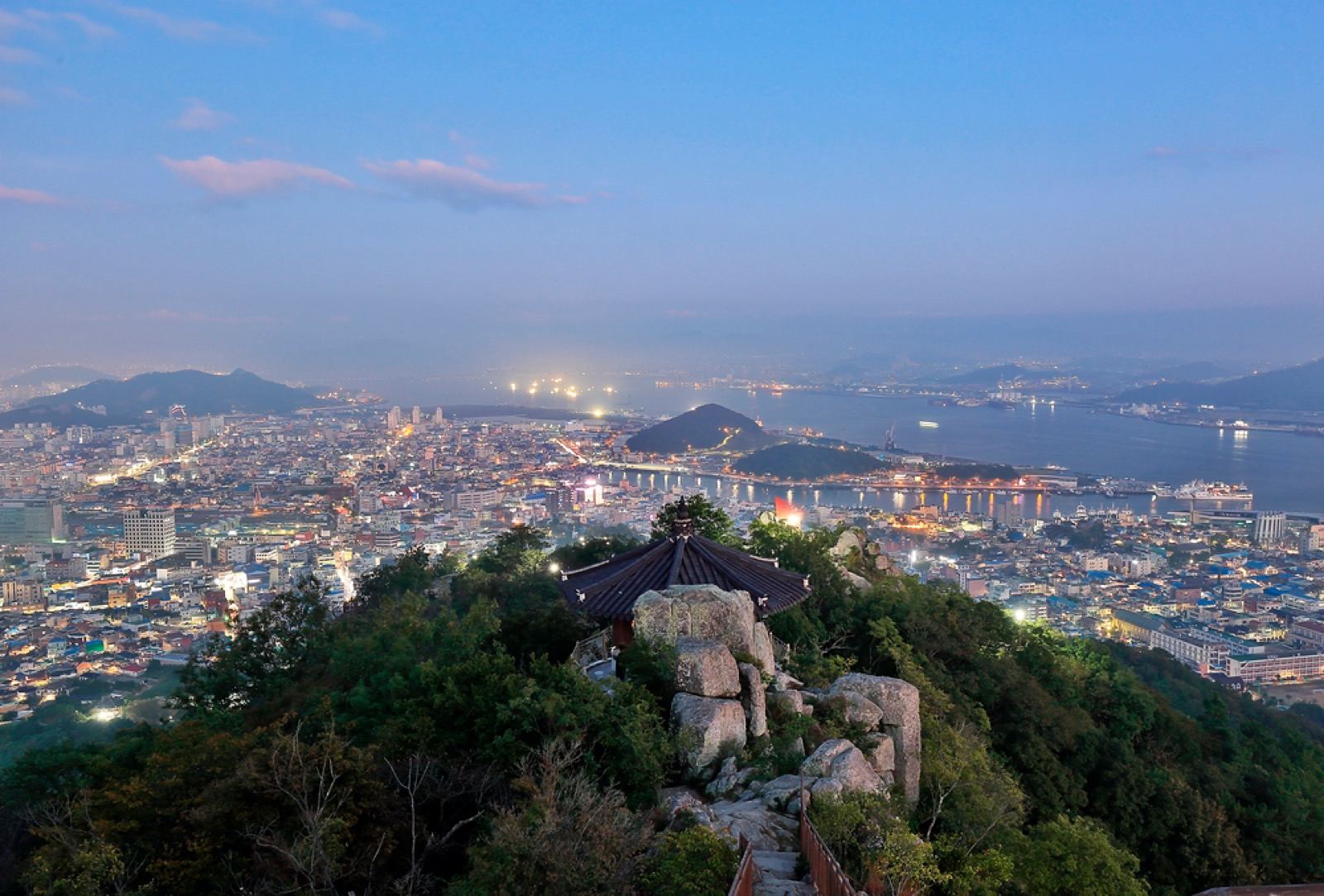 Mokpo's city lights and harbor at dusk seen from a pavilion on Yudalsan mountain