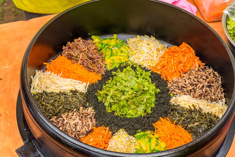 A colorful array of seasoned Korean vegetables and greens (namul)